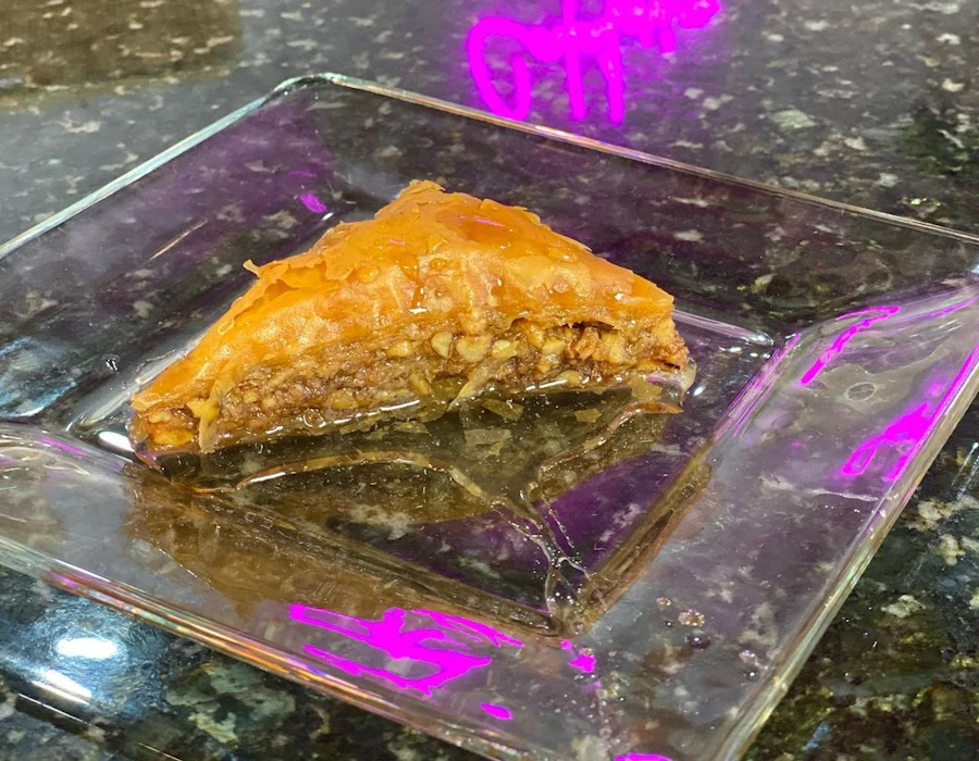 Honey-soaked baklava with chopped nuts